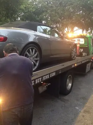 Convertible being towed by AC Towing