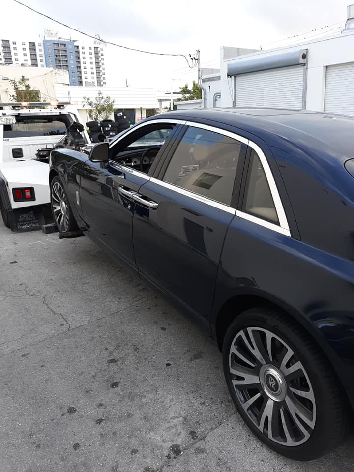 Rolls-Royce being towed by AC Towing